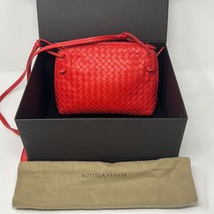 10x7 Bottega Veneta red leather woven classic handbag with adjustable strap.